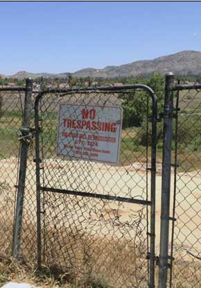 Photo of gate with No Trersspassing sign