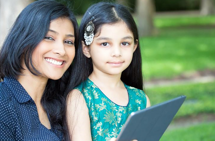 Mother and daughter with laptop.